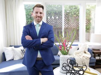 Host, Orlando Soria stands in Michele's newly rennovated living room hours before the reveal party.